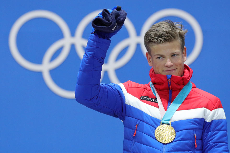 <p>Gold medalist Johannes Hoesflot Klaebo of Norway celebrates winning gold in the cross-country men’s sprint classic. Federico Pellegrino of Italy won silver, while Alexander Bolshunov of Olympic Athletes from Russia won bronze. (Getty) </p>