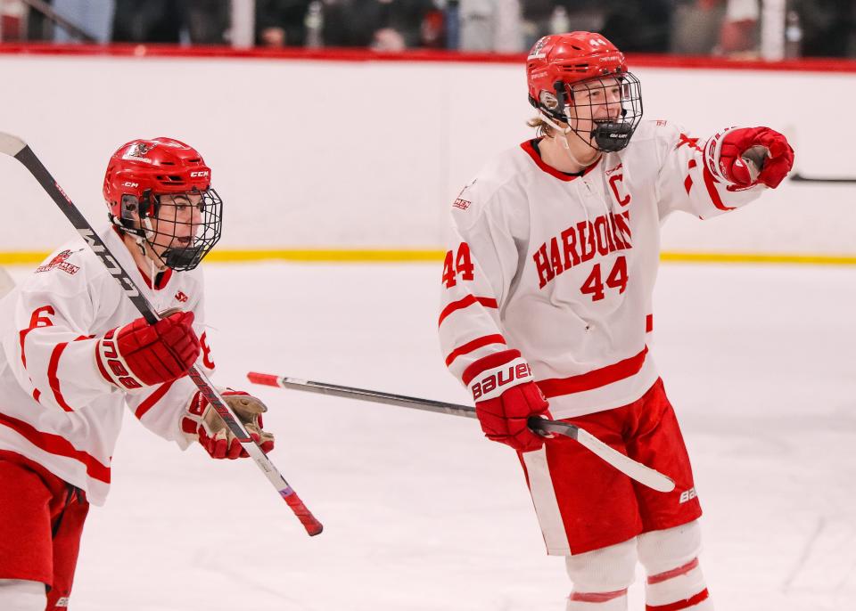 Hingham's Paul Dzavik, right, celebrates a goal with Travis Rugg during a game against Duxbury at Pilgrim Skating Arena in Hingham on Monday, January 29, 2024.