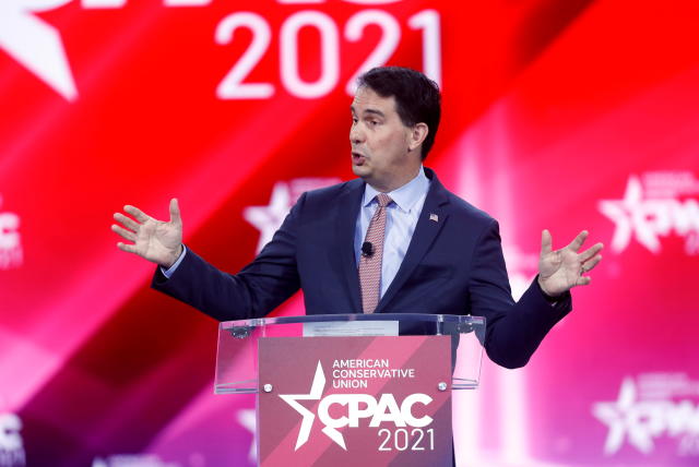 Former Gov. Scott Walker at a podium marked American Conservative Union CPAC 2021.