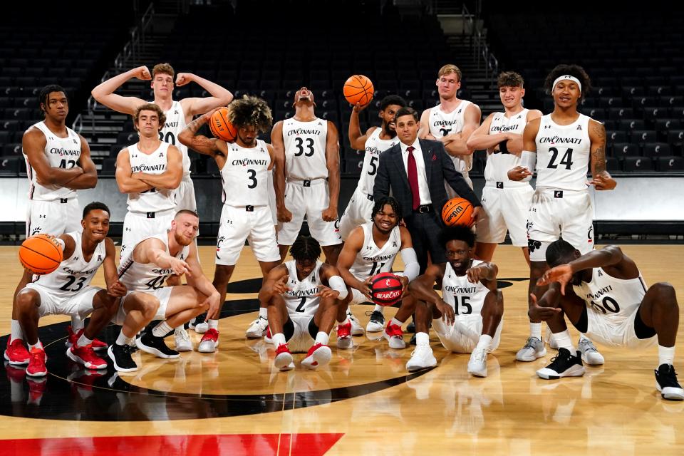 The Cincinnati Bearcats men's basketball team poses for photos during media day before practice, Monday, Oct. 4, 2021, at Fifth Third Arena in Cincinnati.