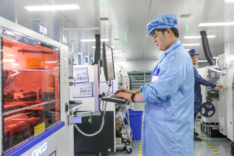 HUZHOU, CHINA - AUGUST 17, 2023 - A staff member produces integrated circuit chips at the production workshop of Zhejiang Jingshi Microelectronics Technology Co., Ltd. in Huzhou, Zhejiang province, China, Aug. 17, 2023. (Photo by Costfoto/NurPhoto via Getty Images)