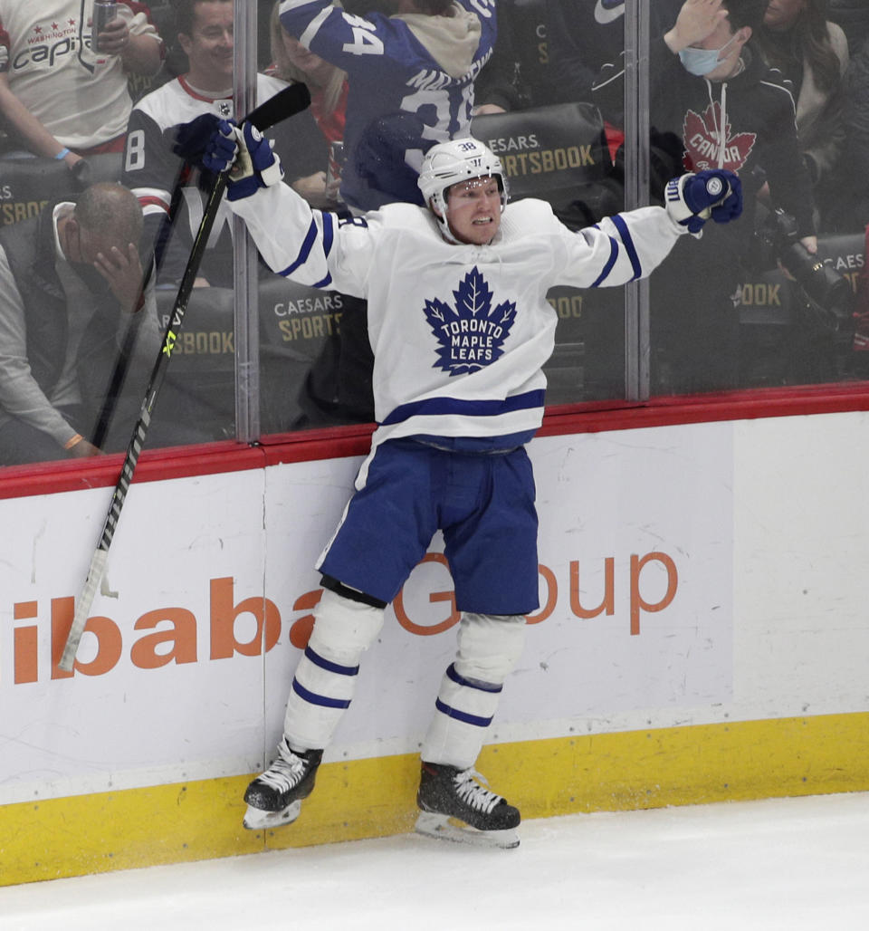 Toronto Maple Leafs' Rasmus Sandin celebrates after scoring a goal against the Washington Capitals during the third period of an NHL hockey game Monday, Feb. 28, 2022, in Washington. (AP Photo/Luis M. Alvarez)