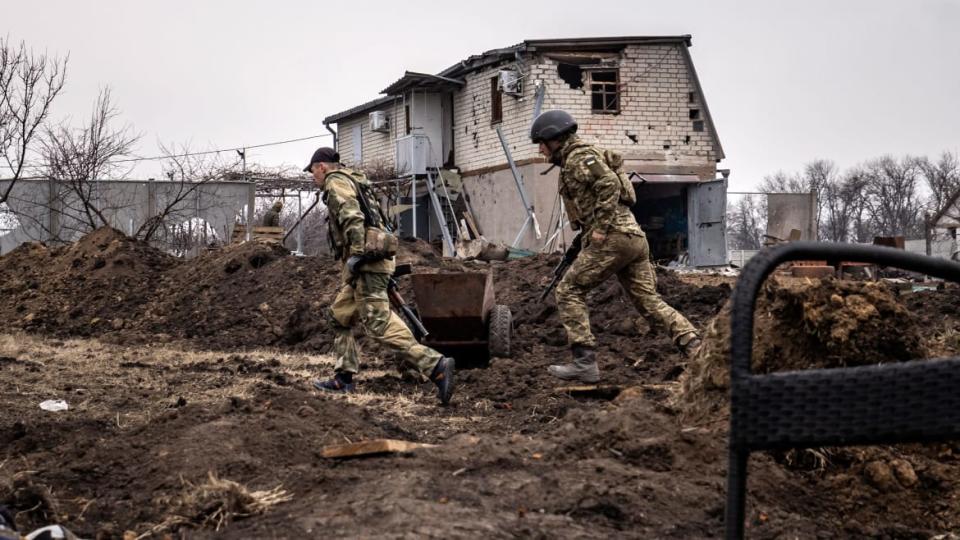 <div class="inline-image__caption"><p>Ukrainian servicemen run at the front line east of Kharkiv on March 31, 2022.</p></div> <div class="inline-image__credit">Fadel Senna//AFP via Getty Images</div>