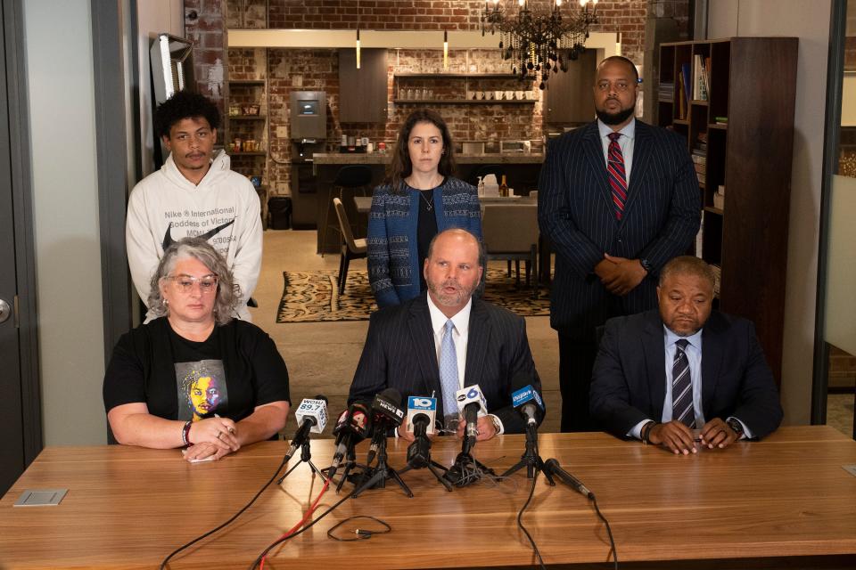 Donovan Lewis' mother, Rebecca Duran, from left, Attorney Rex Elliott and Attorney Michael Wright speak Friday during a news conference at Cooper Elliott Law Offices in Columbus after a grand jury indicted former Columbus police officer Ricky Anderson in connection with the fatal shooting of Lewis in August 2022.