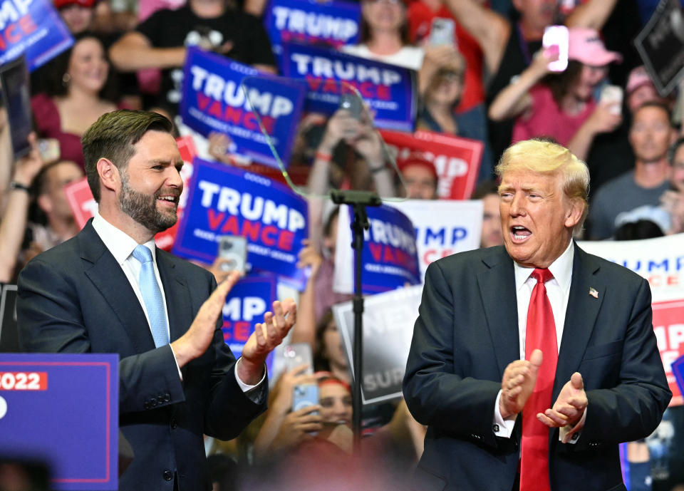 TOPSHOT - Former US President and 2024 presidential nominee Donald Trump (R) with US Senator and vice presidential nominee J.D. Vance attend their first campaign rally together at Van Andel Arena in Grand Rapids, Michigan, on July 20, 2024. (Photo by Jim WATSON / AFP) (Photo by JIM WATSON/AFP via Getty Images)