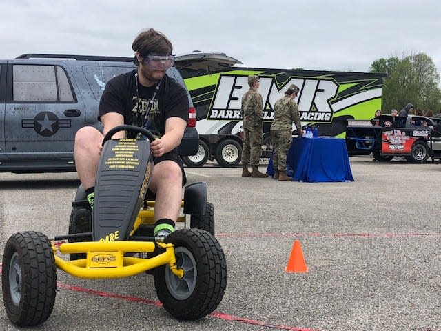 BNL senior Blake Wilson drives a pedal car while wearing Fatal Vision goggles that simulate impaired driving. The activity was sponsored by the NLCC criminal justice program. Instructor Rebecca Dever said her students also practiced conducting field sobriety tests with students wearing the goggles.