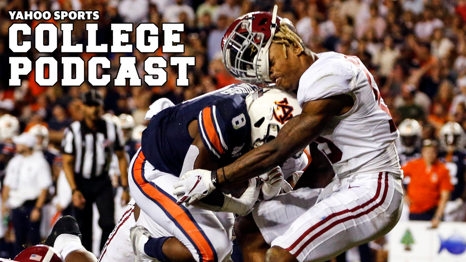 Alabama defensive back Xavier McKinney (15) loses his helmet as Auburn running back Shaun Shivers (8) runs through him for a touchdown during the second half of an NCAA college football game Saturday, Nov. 30, 2019, in Auburn, Ala. (AP Photo/Butch Dill)