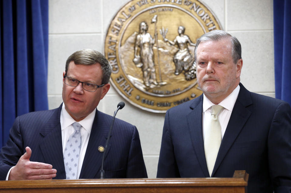 FILE - In this Tuesday, March 28, 2017 file photo, Republican leaders Rep. Tim Moore, left, and Sen. Phil Berger, hold a news conference in Raleigh, N.C. North Carolina Republican lawmakers said Wednesday night that they have an agreement with Democratic Gov. Roy Cooper on legislation to resolve a standoff over the state's "bathroom bill." Details about the replacement weren't immediately available, Moore and Berger declined to take questions during a brief news conference. (Chris Seward/The News & Observer via AP, File)