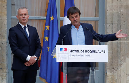 Nicolas Hulot, outgoing French Minister for Ecology, Sustainable Development and Energy, speaks next to French National Assembly speaker Francois de Rugy, newly-appointed Ecology Minister at a handover ceremony in Paris, France, September 4, 2018. REUTERS/Charles Platiau