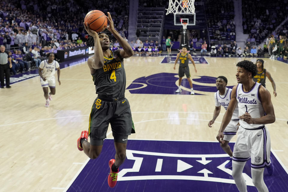 Baylor guard Ja'Kobe Walter (4) puts up a shot during the first half of an NCAA college basketball game against Kansas State Tuesday, Jan. 16, 2024, in Manhattan, Kan. (AP Photo/Charlie Riedel)