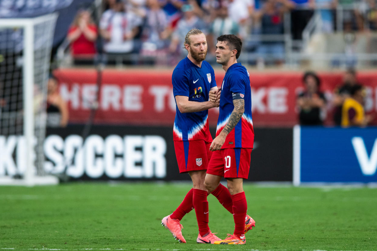 ORLANDO, FL - JUNE 12: Tim Ream #13 and Christian Pulisic #10 of the United States celebrate a goal during an international friendly game between Brazil and USMNT at Camping World Stadium on June 12, 2024 in Orlando, Florida. (Photo by Jeremy Reper/ISI Photos/Getty Images)