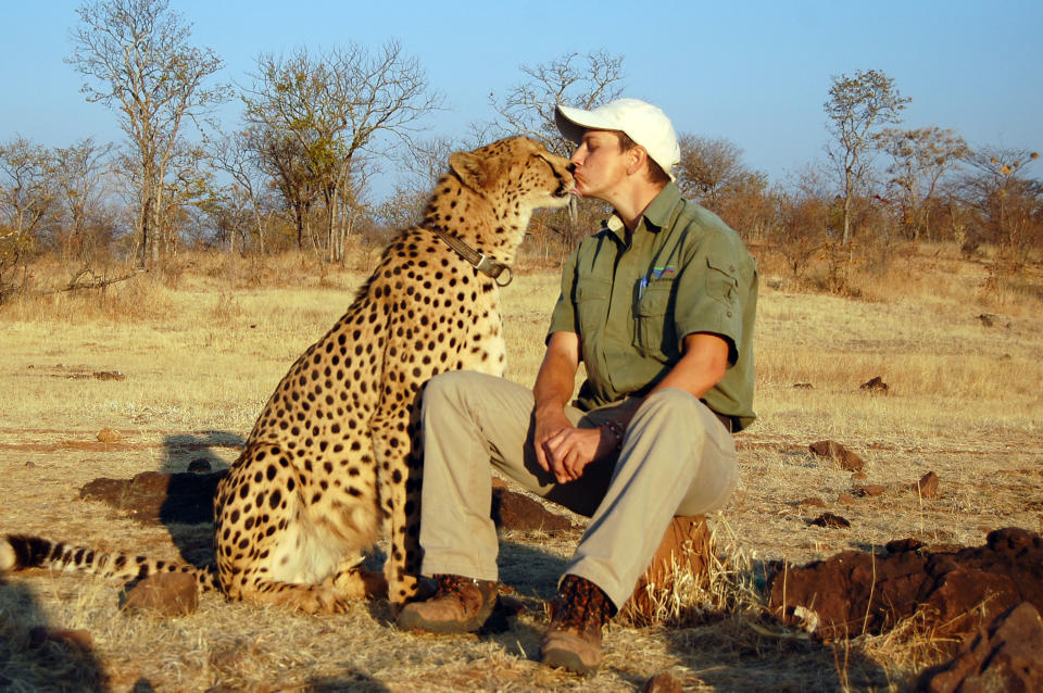 <p>Photographer Ed Oelofse and his pal, Sylvester the cheetah. (Photo: Caters News) </p>