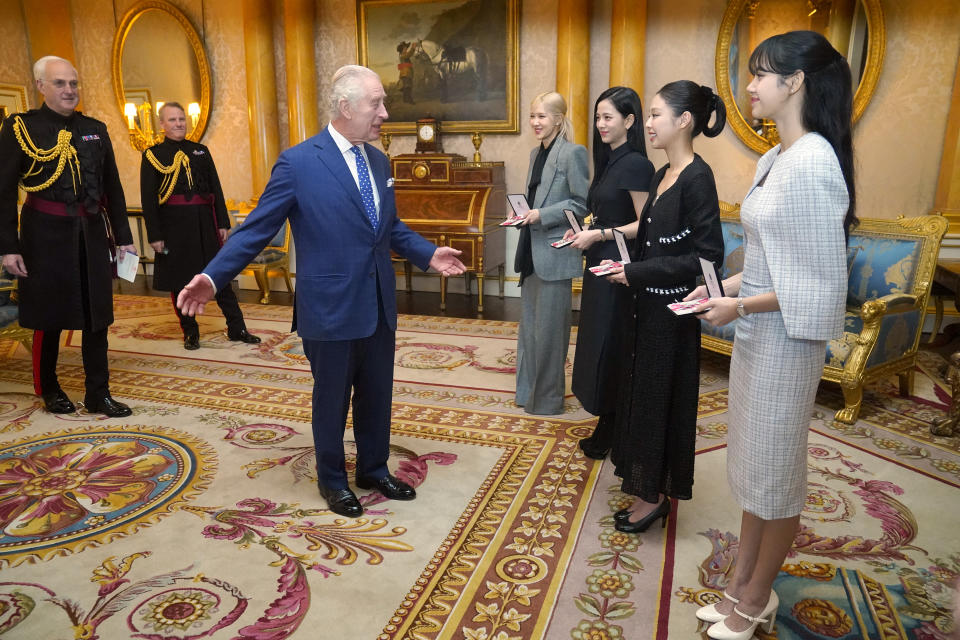 LONDON, ENGLAND - NOVEMBER 22: King Charles III presents the members of the K-Pop band Blackpink, (left to right) Rose (Roseanne Park), Jisoo Kim, Jennie Kim, and Lisa (Lalisa Manoban), with Honorary MBEs (MBE (Member of the Order of the British Empire) during a special investiture ceremony in the presence of the President of South Korea, Yoon Suk Yeol, and his wife, Kim Keon Hee at Buckingham Palace, on November 22, 2023 in London, England. (Photo by Victoria Jones - Pool/Getty Images)