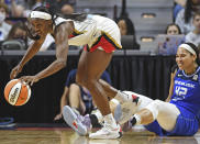 Las Vegas Aces guard Jackie Young (0) takes the ball away from Connecticut Sun center Brionna Jones (42) during a WNBA basketball game, Sunday, July 17, 2022, in Uncasville, Conn. (Sean D. Elliot/The Day via AP)