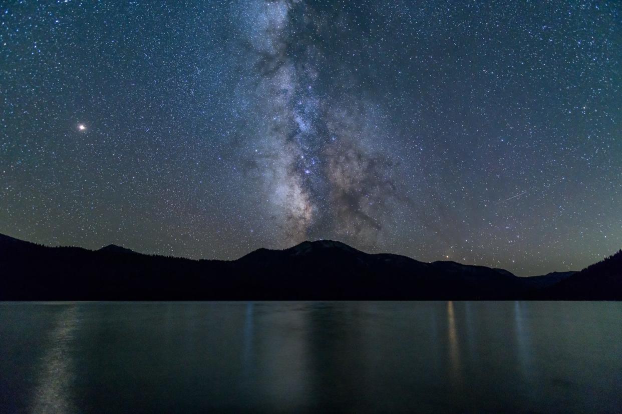 The Milky Way is visible over Alturas Lake in Idaho.