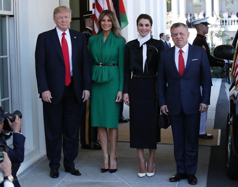 <p>To greet King Abdullah II of Jordan and his wife Queen Rania, Melania wore a jade belted Herve Pierre dress with a gathered front and slit skirt. She finished the outfit with a pair of black snake-print heels by Christian Louboutin, a known favorite of hers.</p>