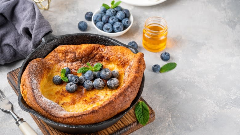 Dutch baby with blueberries and honey