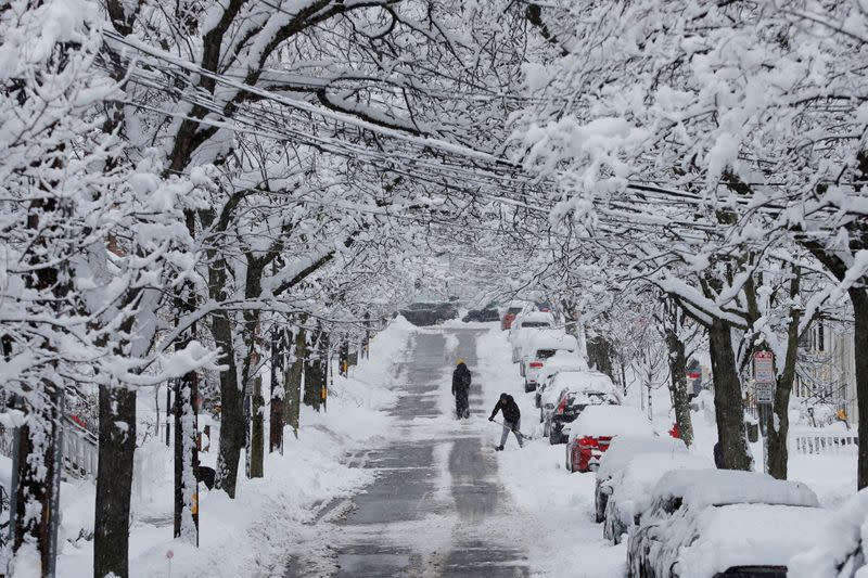 FILE PHOTO: Residents shovel out following a winter snow storm in Somerville