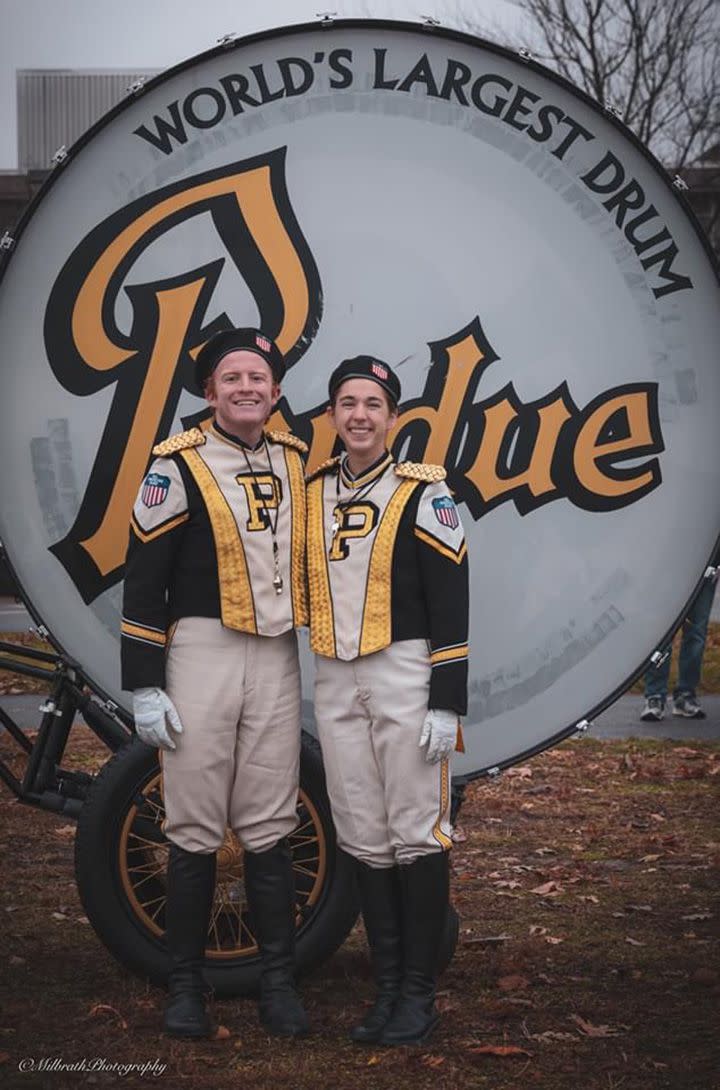 Purdue 2019-2020 Drum Majors Brendan Schultz and Lucy Bays posing in front of the World's Largest Drum prior to the Purdue vs. Indiana football game on November 30, 2019.