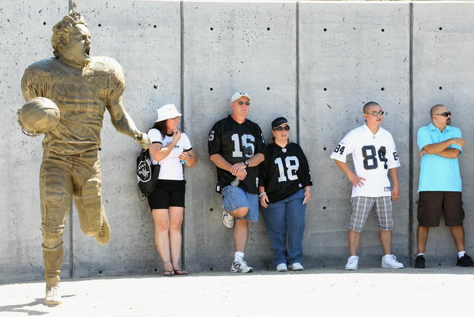 GLENDALE, AZ - SEPTEMBER 26: Fans of the Oakland Raiders stand near the Pat Tillman statue before the NFL game against the Arizona Cardinals at the University of Phoenix Stadium on September 26, 2010 in Glendale, Arizona. (Photo by Christian Petersen/Getty Images)