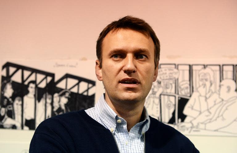 Russian protest leader Alexei Navalny visits an art exhibition after a court hearing in the city of Kirov, on October 16, 2013