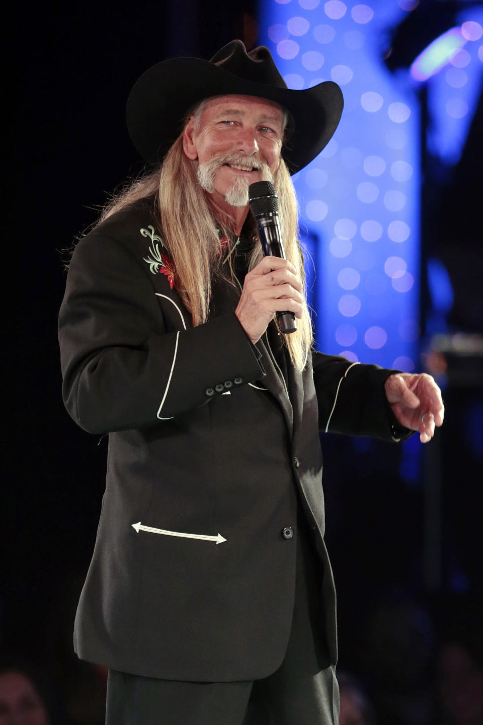 FILE - Dean Dillon accepts the Icon Award at the BMI Country Awards in Nashville, Tenn. on Nov. 5, 2013. Dillon, along with Hank Williams, Jr., and Marty Stuart, will be inducted into the Country Music Hall of Fame. (AP Photo/Mark Humphrey)