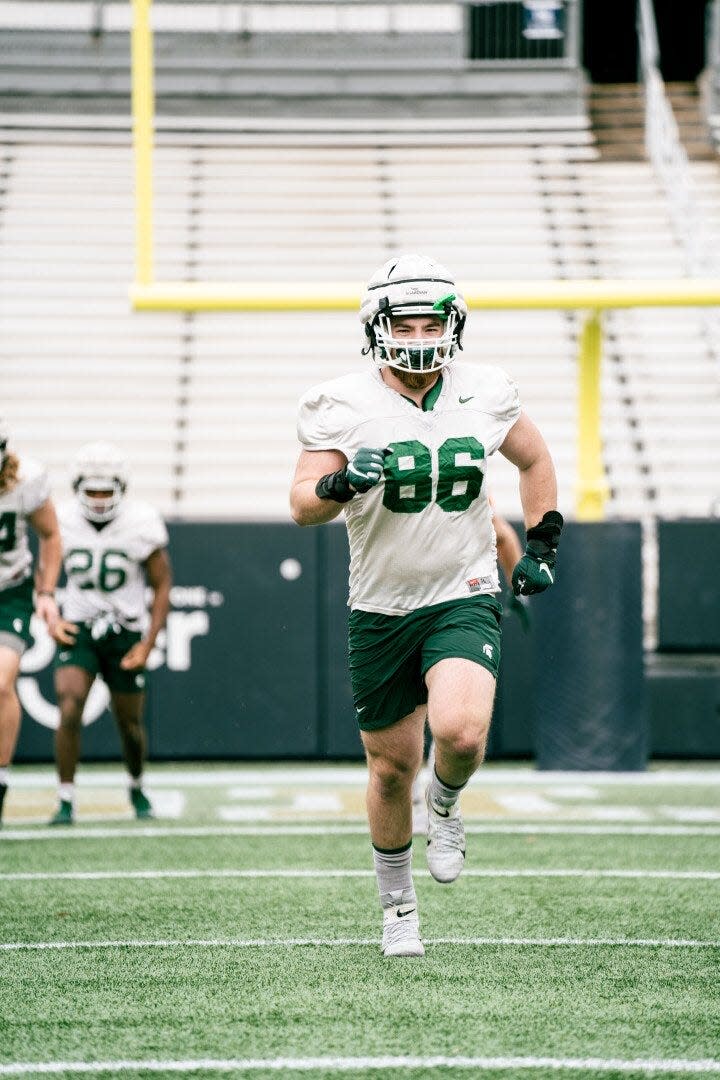 Michigan State defensive lineman Drew Beesley works out during practice on Sunday, Dec. 26, 2021, in Atlanta.