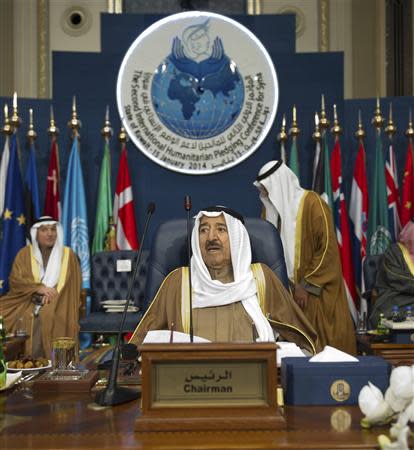 Kuwaiti Emir Sheikh Sabah al-Ahmed al-Sabah presides over the opening session of the Syrian Donors Conference at Bayan Palace Liberation Hall in Kuwait City January 15, 2014. Donors including the United States and wealthy Gulf Arab countries pledged $1 billion on Wednesday for U.N. humanitarian efforts in Syria, devastated by almost three years of civil war. REUTERS/Stephanie McGehee