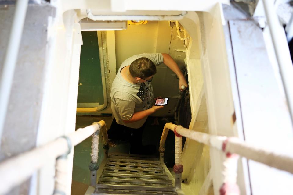 The USS Orleck briefly opened for tours on June 10 as Christian Jones showed his family on his phone. Volunteers are getting the historic ship ready for its official opening as a floating museum, but a date has not been set.