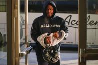 Seattle Seahawks running back Marshawn Lynch walks into the training facility for their NFL Super Bowl XLVIII football practice in East Rutherford, New Jersey, January 30, 2014. REUTERS/Shannon Stapleton