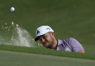 Xander Schauffele, of the United States, hits out of a greenside bunker on the 7th hole during the second round of the Hero World Challenge PGA Tour at the Albany Golf Club in New Providence, Bahamas, Friday, Dec. 2, 2022. (AP Photo/Fernando Llano)