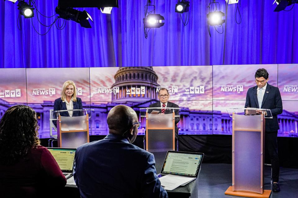 Democratic candidates Rep. Carolyn Maloney, Rep. Jerry Nadler and attorney Suraj Patel stand at lecterns during a primary debate.