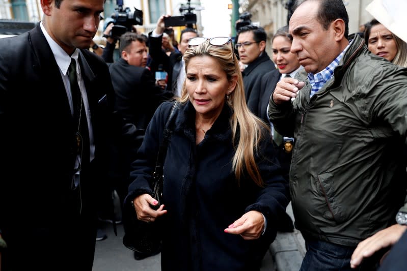 Bolivian Interim President Jeanine Anez walks out of the Presidential Palace, in La Paz