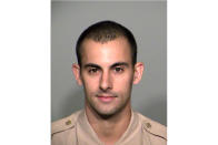 A photo provided by the Las Vegas Metropolitan Police Department shows officer Shay Kellin Mikalonis. Edgar Samaniego, accused of shooting and critically wounding Mikalonis, is to remain jailed pending arraignment Friday, June 5, 2020, on attempted murder and weapon charges, the man's public defense lawyer said. Mikalonis, 29, underwent surgery for spine and head injuries after being hit in the back of the neck June 1 by a gunshot that officials say was fired from across Las Vegas Boulevard during a nighttime protest over the May 25 death of a black man in police custody in Minneapolis. (Las Vegas Metropolitan Police Department via AP)