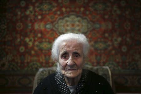 Silvard Atajyan, 103, sits at home during an interview with Reuters in Yerevan, Armenia April 20, 2015. Now 103 years old, Atajyan remembers vividly when French soldiers saved her, her sister and their parents from the mass killings by Ottoman Turks that 100 years on has stoked tempers once again. REUTERS/David Mdzinarishvili