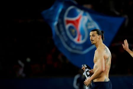 Paris St Germain's Zlatan Ibrahimovic walks out of the pitch at the end of the French Ligue 1 soccer match against En Avant Guingamp at Parc des Princes stadium in Paris, France, May 8, 2015. REUTERS/Gonzalo Fuentes/File Photo