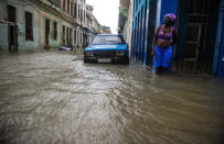 <p>A Cuban stays in a flooded street in Havana, on Sept. 10, 2017. (Photo: Yamil Lage/AFP/Getty Images) </p>