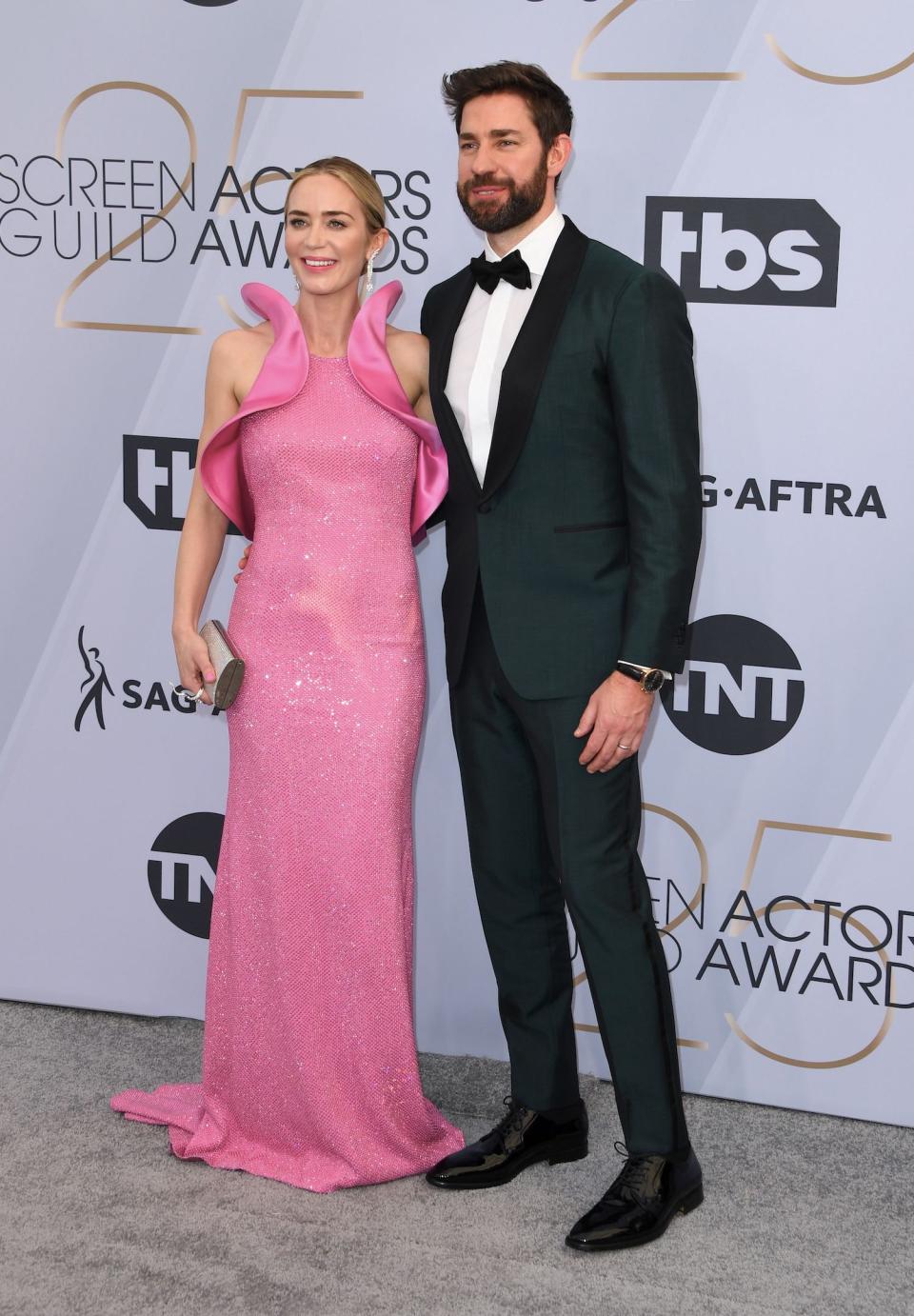 <p>Emily Blunt and John Krasinski left their two daughters at home for a date night at the SAGs. Blunt, wearing a custom Michael Kors dress, is a double nominee, up for Outstanding Performance by a Female Actor in a Leading Role for <em>Mary Poppins Returns</em> and Outstanding Performance by a Female Actor in a Supporting Role for her work in <em>A Quiet Place</em>. Meanwhile, Krasinski looked dapper in custom Isaia. (Photo: Getty Images) </p>