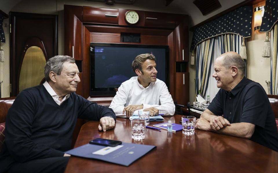 Italy's Prime Minister Mario Draghi, France's President Emmanuel Macron and German Chancellor Olaf Scholz (SPD) sit on a night train traveling to Kyiv on June 16 - Handout 