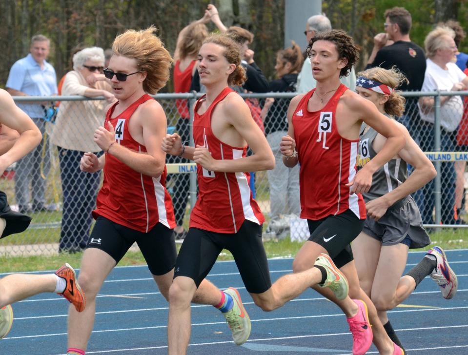 Jacob Wartenberg (left), Blake Fox (middle) and Malaki Gascho (right) participate in the 1600-meter run during the MHSAA Region 31-4 track meet on Friday, May 19 in Indian River, Mich.