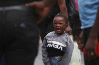 A Haitian migrant child cries at the Padre Infante shelter, in Monterrey, Mexico, Wednesday, Sept. 22, 2021. (AP Photo/Roberto Martinez)