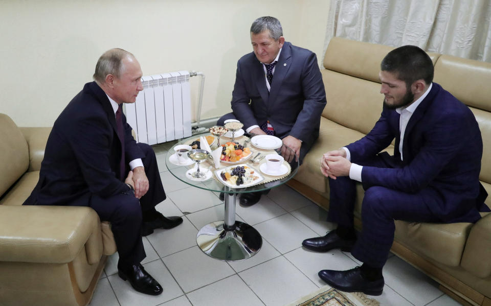 Russian President Vladimir Putin meets with Russian mixed martial arts fighter Khabib Nurmagomedov and his father Abdulmanap Nurmagomedov on the sidelines of a sports forum in Ulyanovsk, Russia. (Sputnik/Mikhail Klimentyev/Kremlin via REUTERS)