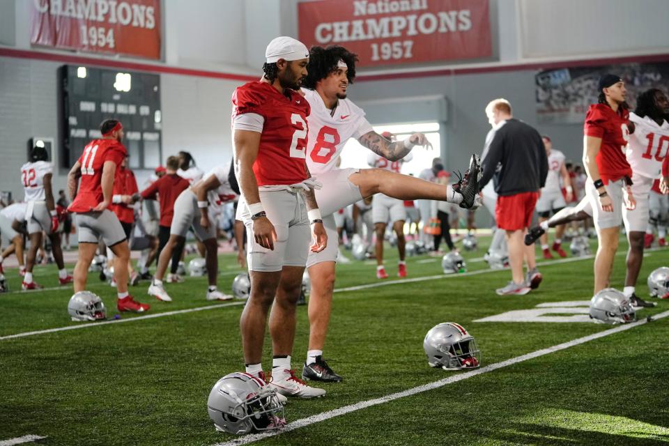 Mar 5, 2024; Columbus, OH, USA; Ohio State Buckeyes wide receiver Emeka Egbuka (2) and safety Lathan Ransom (8) stretch during the first spring practice at the Woody Hayes Athletic Center.