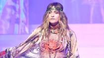 The 21-year-old model strutted down the catwalk in a bold printed bohemian-style ensemble.