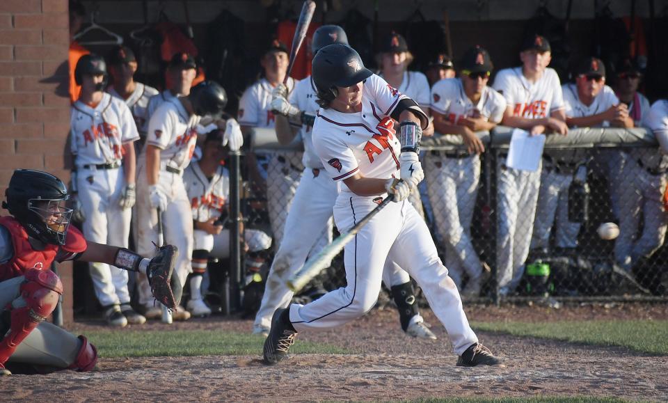 Ames' Aidan Nigh (21) hits a solo home run against Ballard during the third inning at Ames on Tuesday, June 21, 2022, in Ames, Iowa.