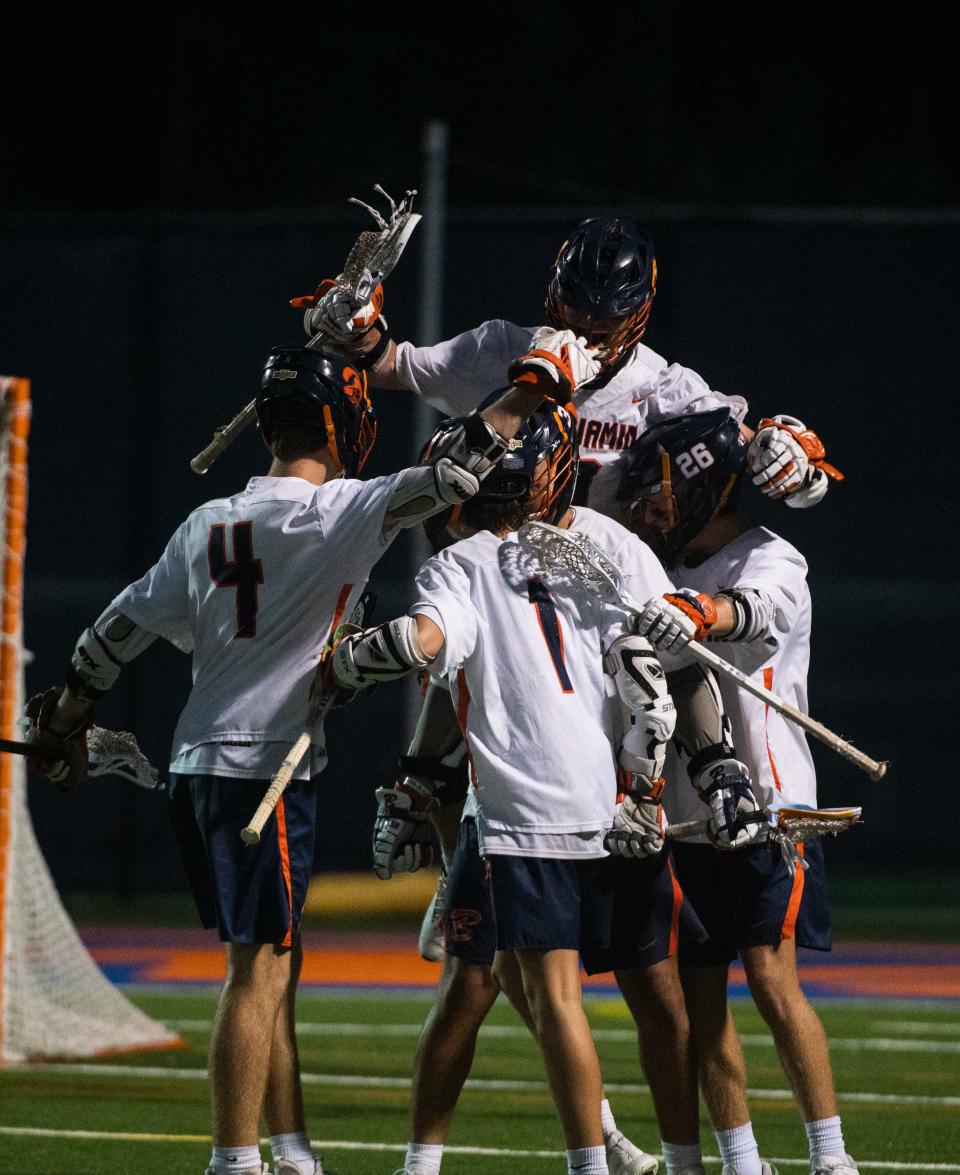 Benjamin attacker Jack Kelleher (1) celebrates scoring a goal in the third quarter with teammates during the District 8-1A boys lacrosse championship game between St. Edward's and host Benjamin on Thursday, April 13, 2023, in Palm Beach Gardens, Fla. Final score, Benjamin, 12, St. Edward's, 9.