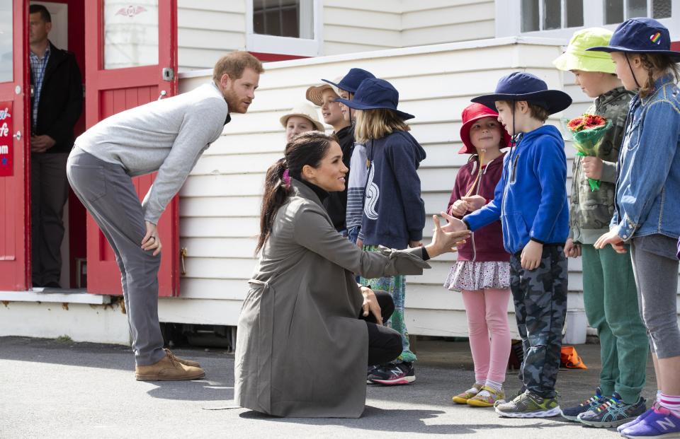 Meghan shook hands with a little boy during a visit to Marenui Cafe in Wellington, New Zealand.