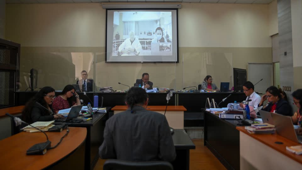 Retired General Benedicto Lucas Garcia (91) is seen on a screen during a video call from the ward of a military hospital where he is being held during his hearing at court in Guatemala City on April 5, 2024. - Johan Ordonez/AFP/Getty Images