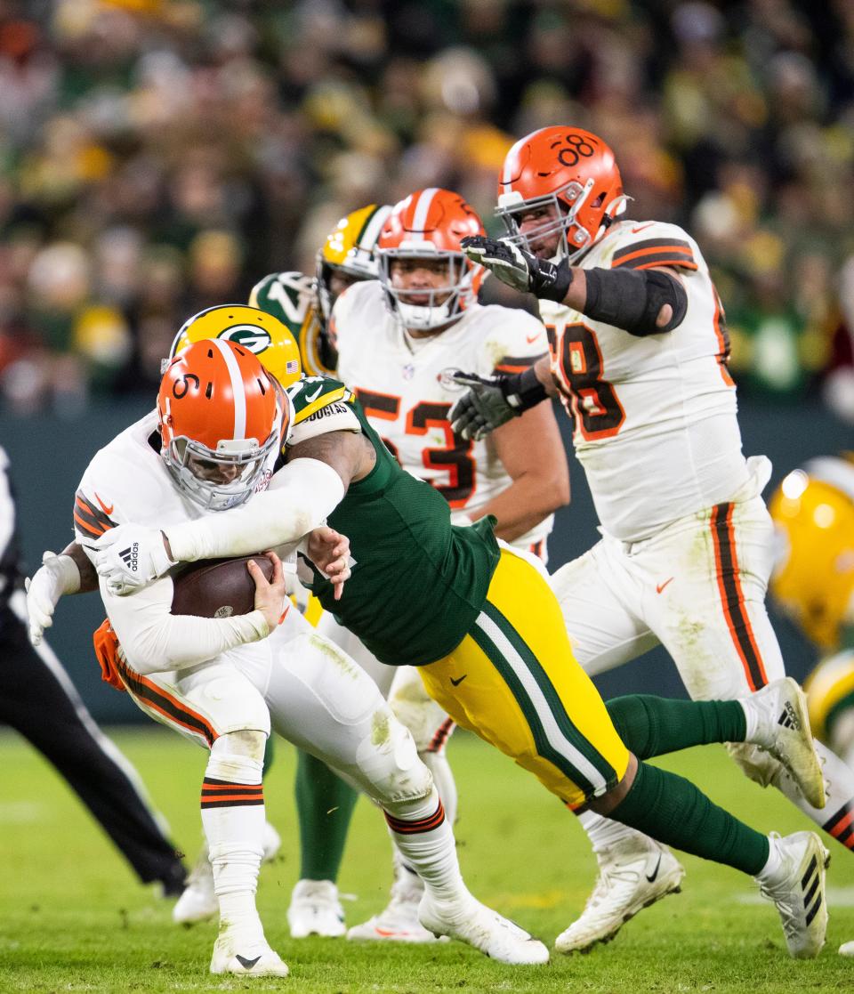Green Bay Packers defensive tackle Tedarrell Slaton (93) sacks Cleveland Browns quarterback Baker Mayfield (6) in the fourth quarter during their football game Saturday, December 25, 2021, at Lambeau Field in Green Bay, Wis. Samantha Madar/USA TODAY NETWORK-Wisconsin 