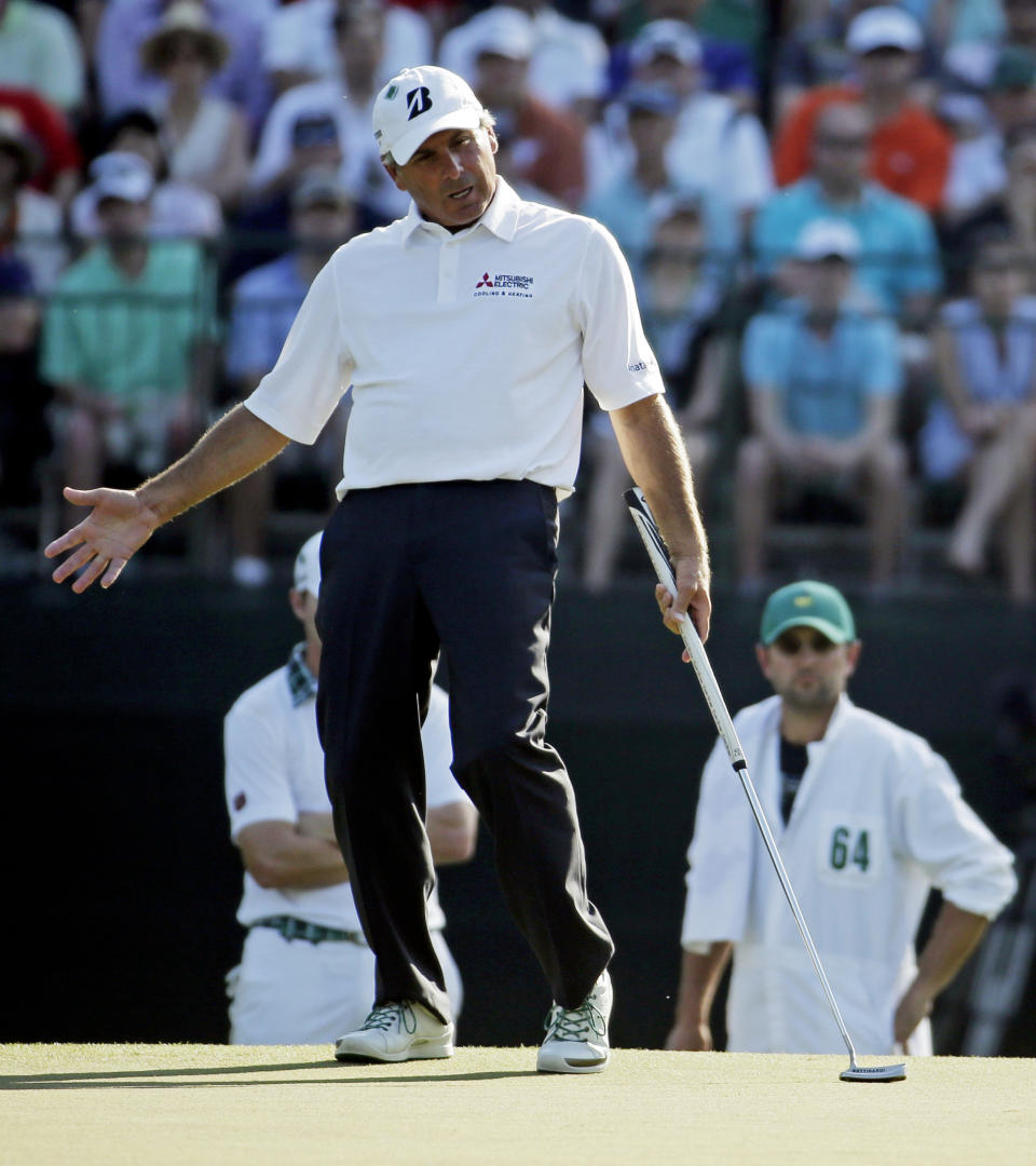 Fred Couples reacts after missing a putt on the 15th hole during the third round of the Masters golf tournament Saturday, April 12, 2014, in Augusta, Ga. (AP Photo/Chris Carlson)